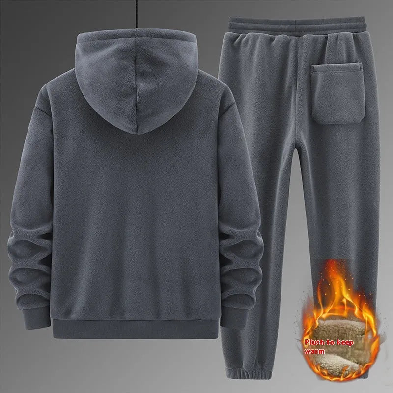 Grey hooded sweater and matching trousers casual sports suit on a hanger.