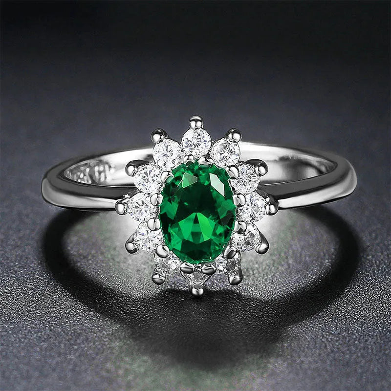 Copper flower-shaped women's ring with zirconium inlay, shown in green, blue, or red electroplated finish.