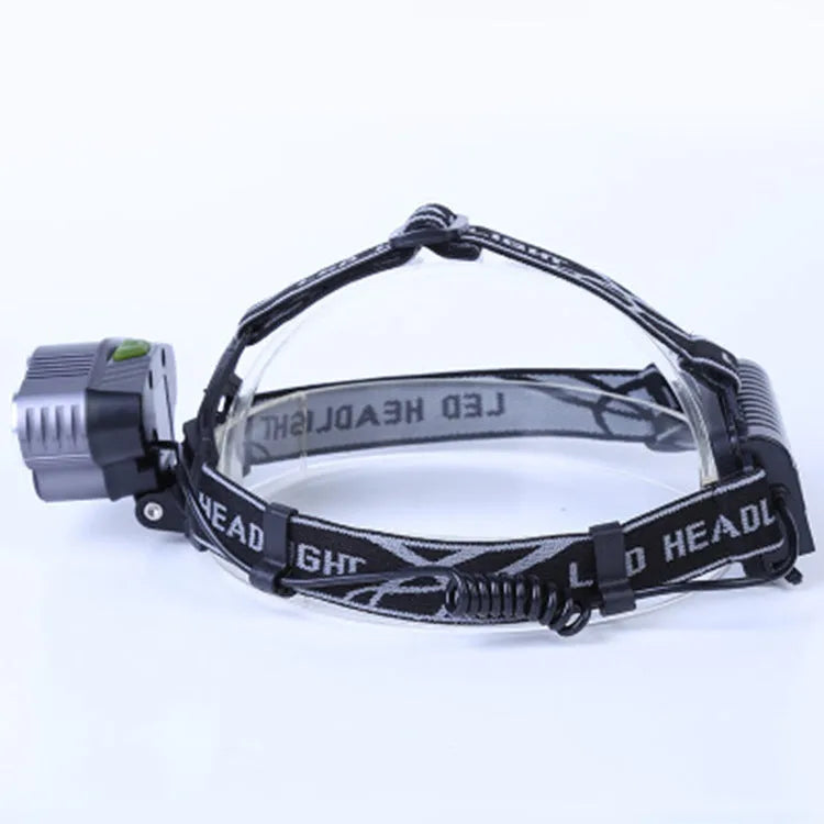 Fixed focus LED head torch with head strap, showing long-range beam for outdoor use.