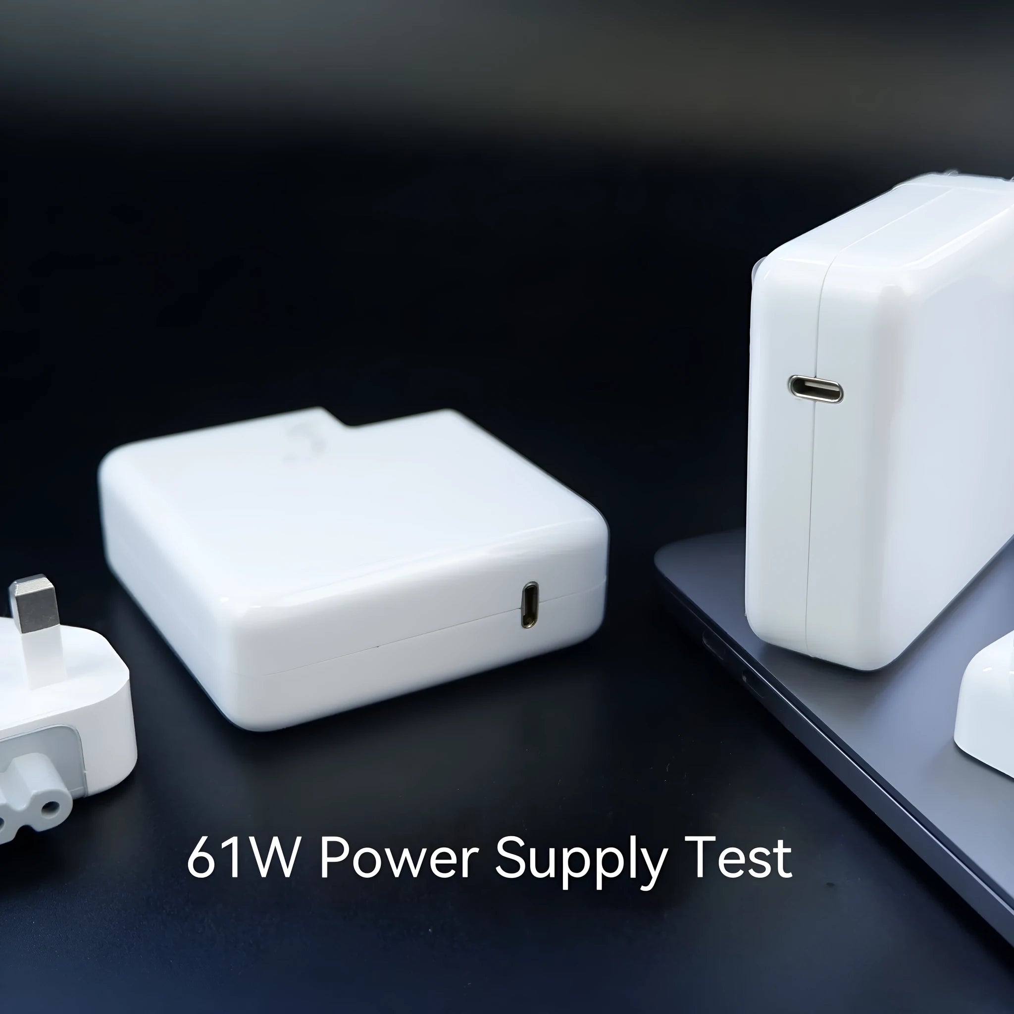Compact 61W wireless laptop power adapter with UK plug and 2m USB-C cable, size 7x7x3cm
