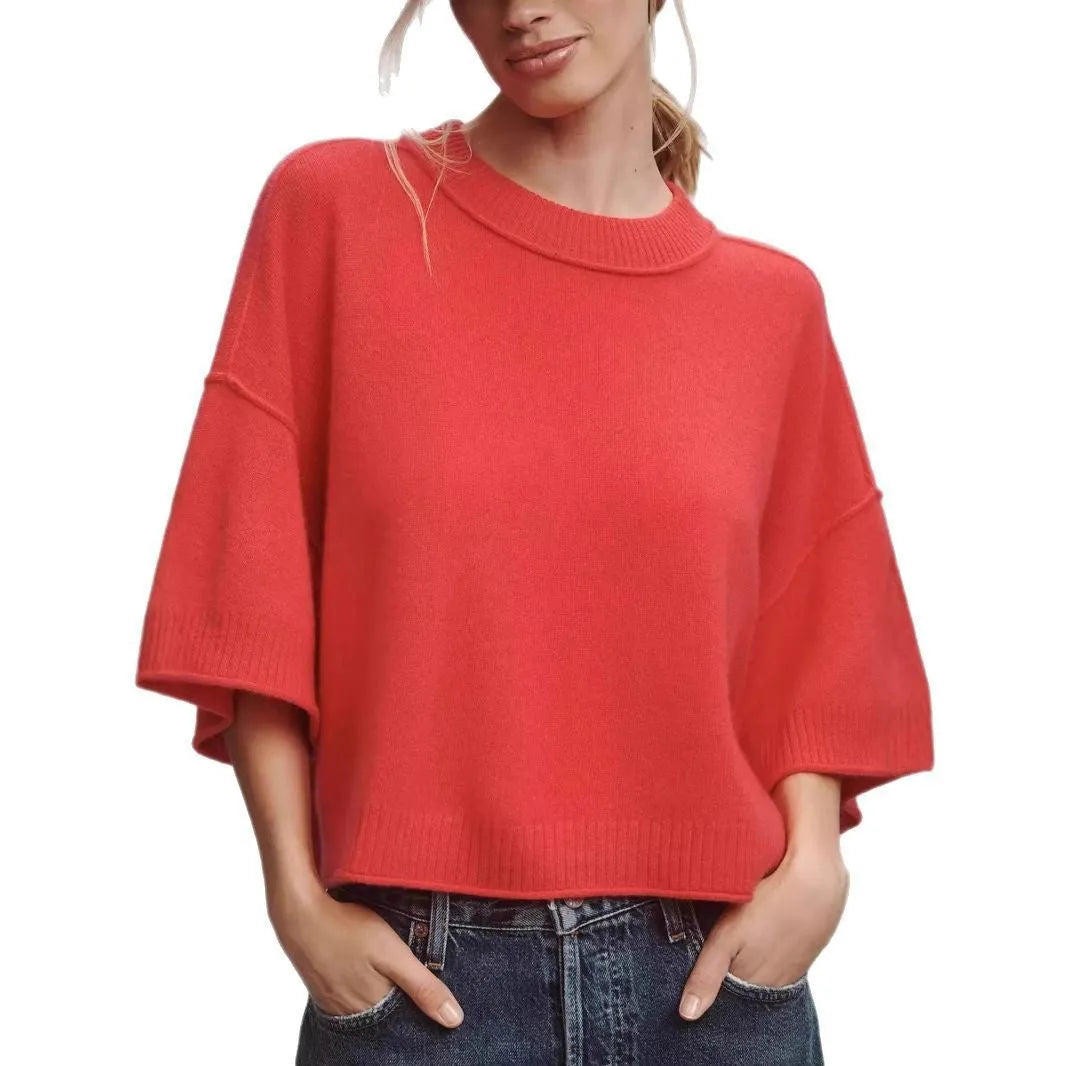 Red short sleeve viscose crop top with an exposed navel design on a model.