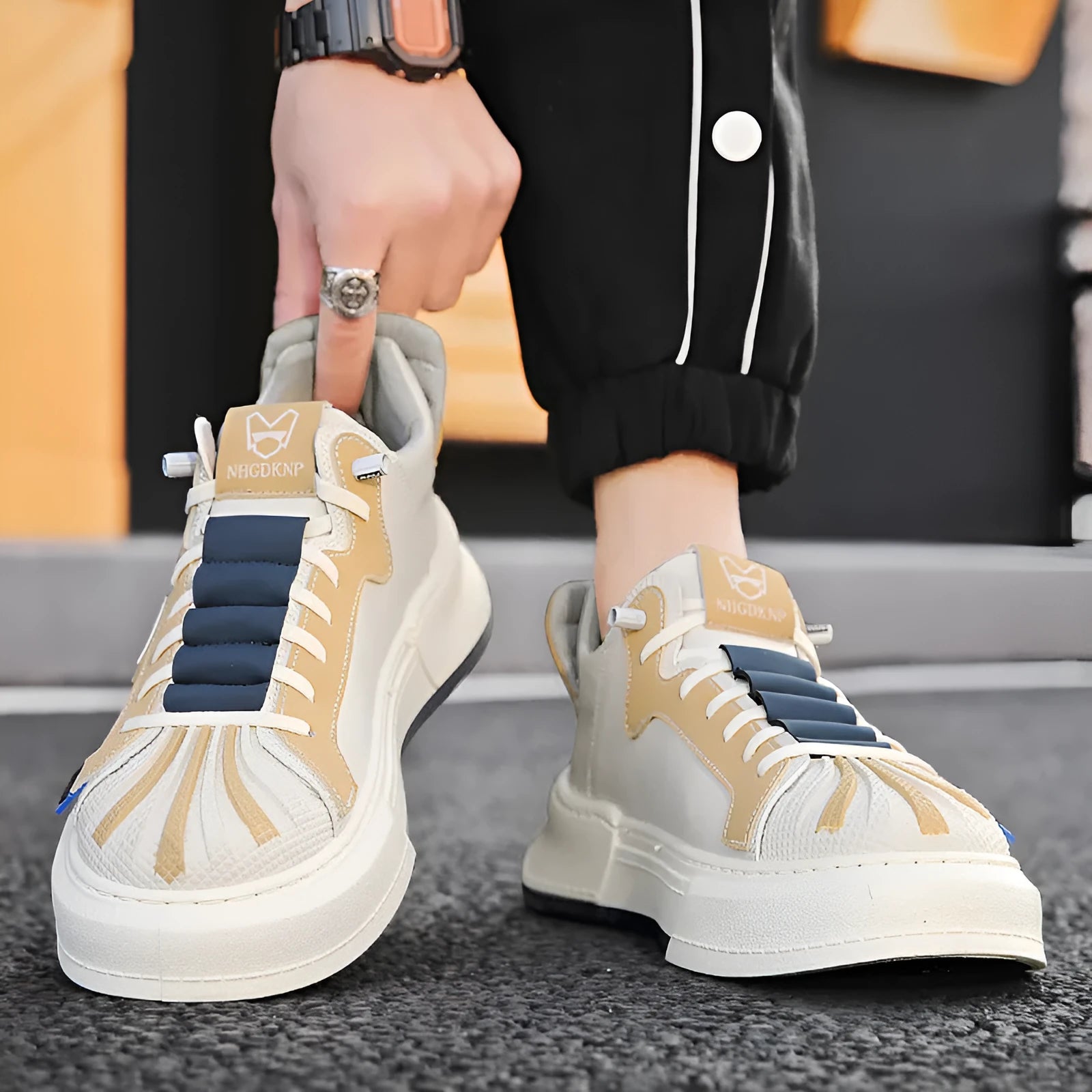 Men's black and beige casual sneakers with elastic band closure and round toe design