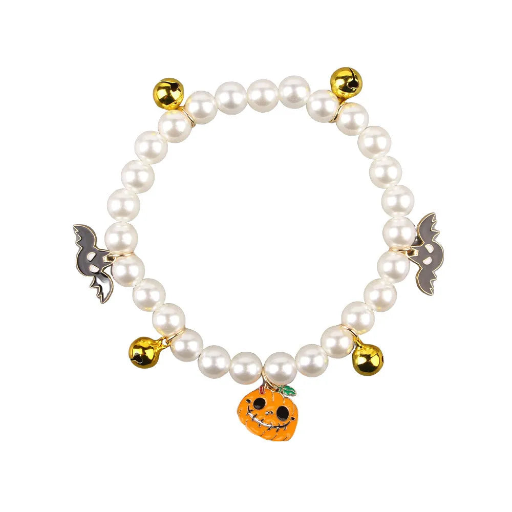 Halloween pearl necklace pet collar with pumpkin designs in purple ghost, skull, and smiling variations