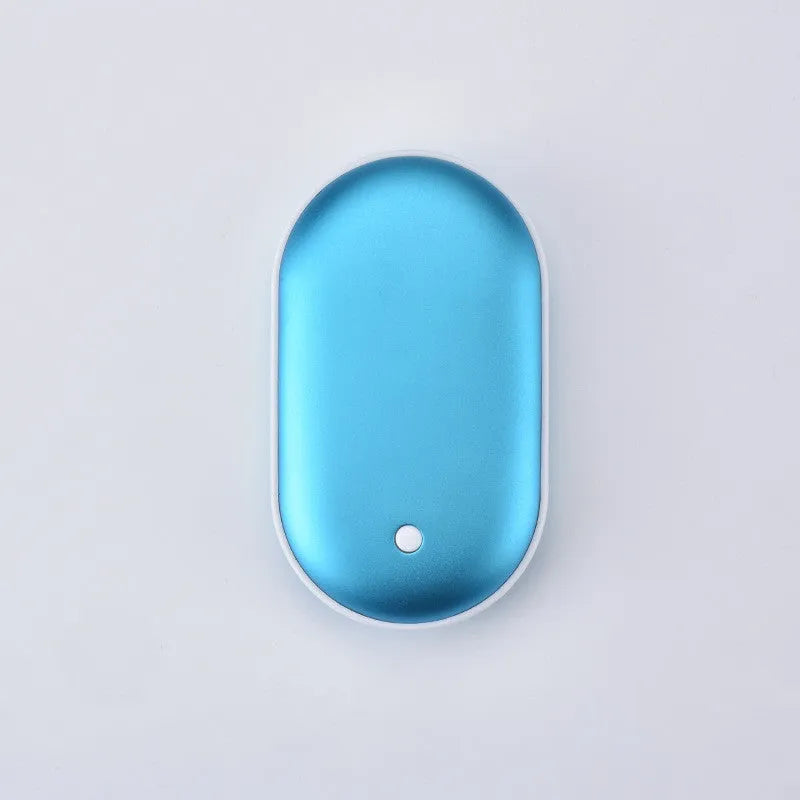 Compact rose gold USB rechargeable hand warmer and power bank with digital display, shown next to its charging cable.