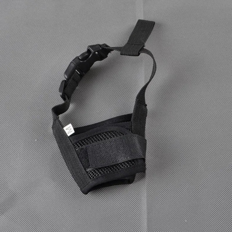 Adjustable plastic dog safety muzzle in black, shown on a size chart.