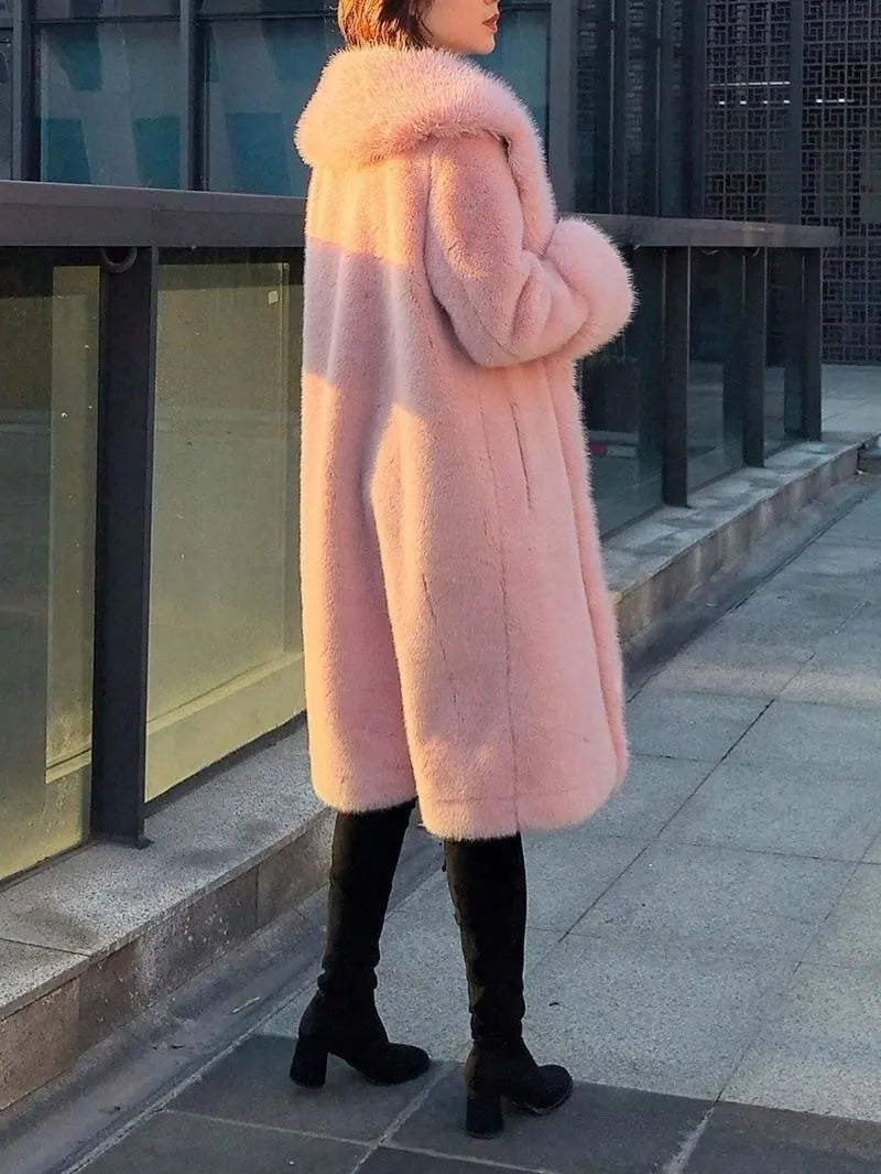 Women's grey thick faux rabbit fur mid-length coat with a fur collar on a hanger.