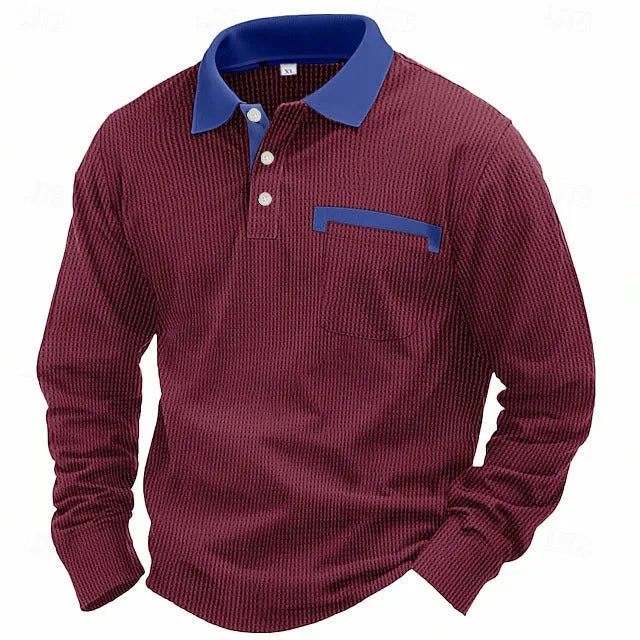 Man wearing a long-sleeved waffle-texture polo shirt in a solid colour with an asymmetric design detail.