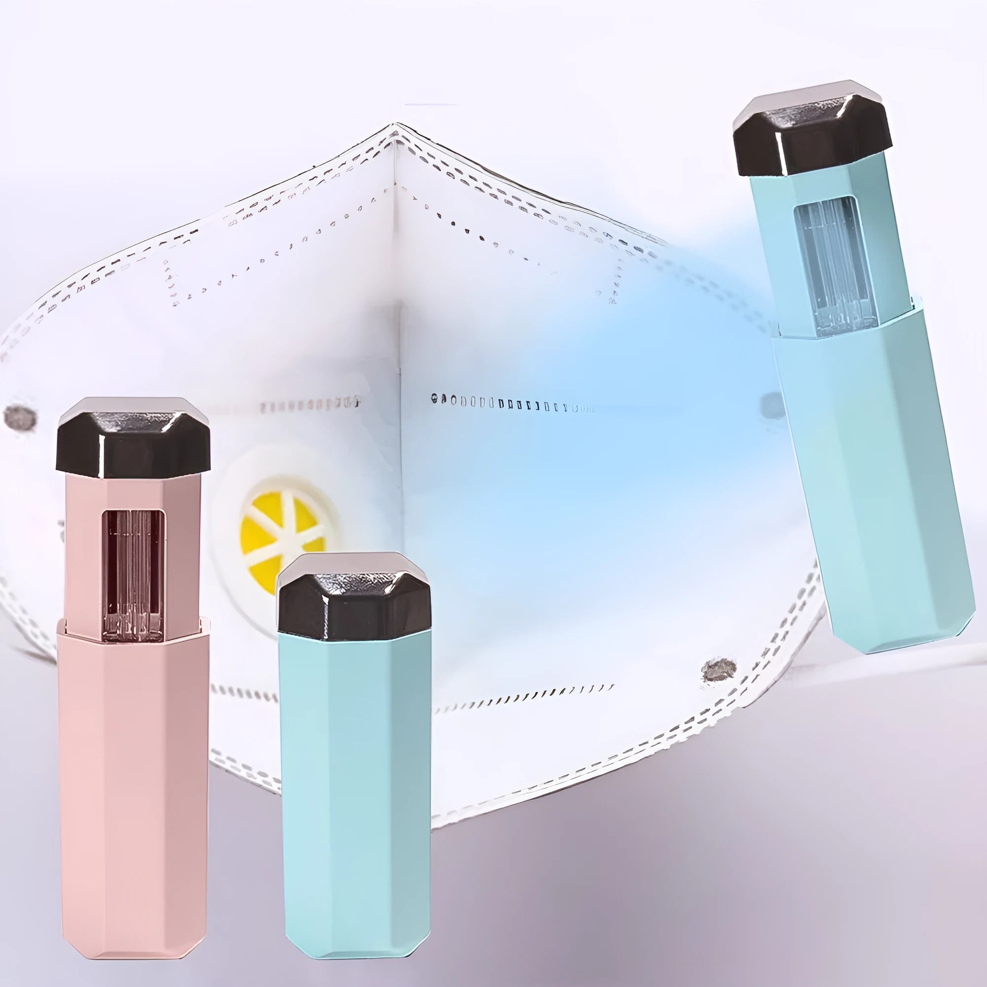 Portable UVC ozone USB germicidal wand in blue with foldable design on a table