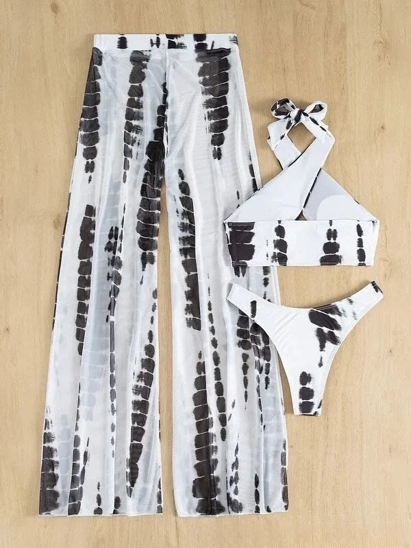 Women's three-piece swimsuit set with bikini top, underpants, and mesh trousers in printed design.