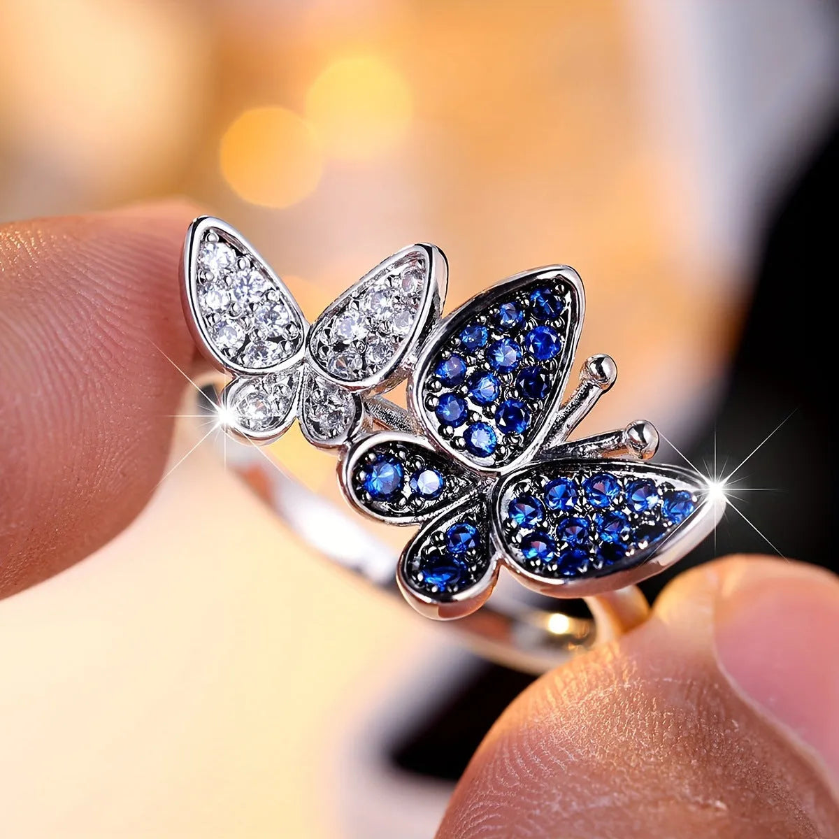 Blue and white copper butterfly ring for women TJZ40135 on plain background