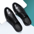 Men's black and brown brogue leather shoes with classic perforated toe design for business wear