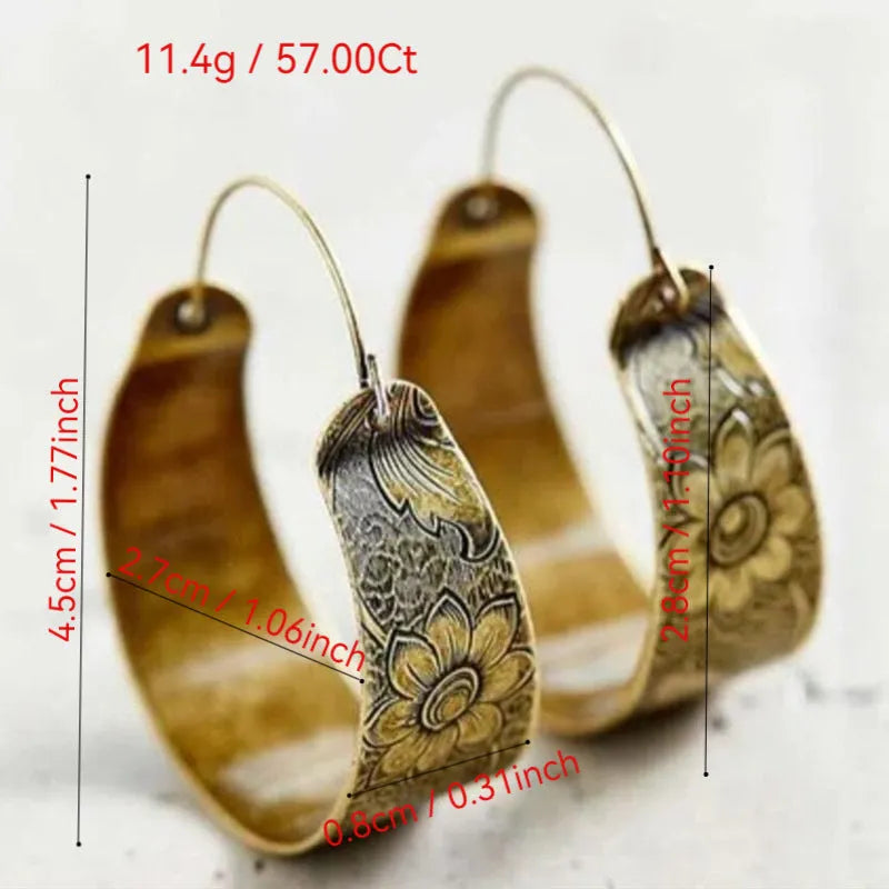 Gold hollow pattern Maillard style alloy geometric petal earrings for women on a white background