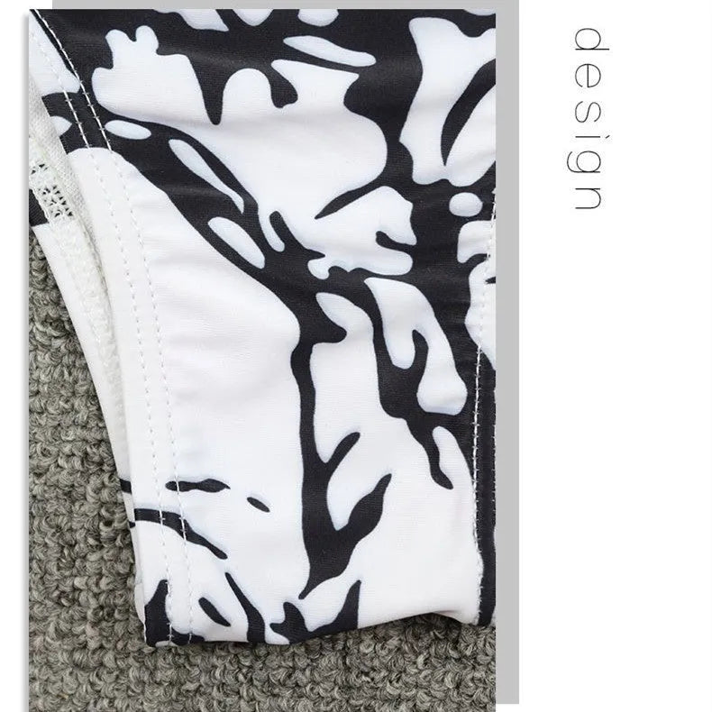 Black and white tie dye two-piece bikini set with chest pad and tied details on the top