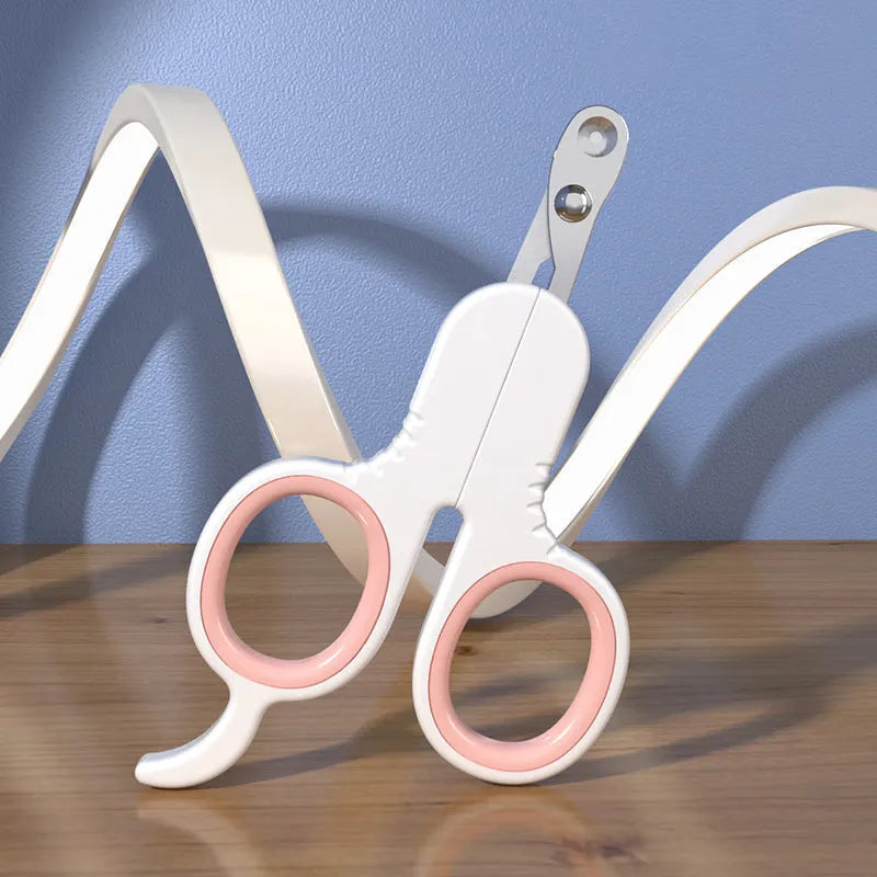 Professional grey pet nail clippers with curved tips and rubber-coated ergonomic handle.