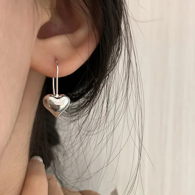 Three-dimensional glossy heart-shaped earrings with Korean style design and silver colour finish