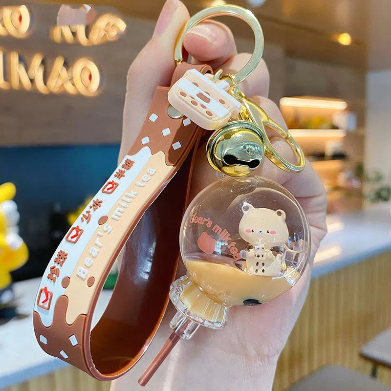 Oil-infused pearl milk tea bear keychain pendant in clear acrylic with alloy ring, featuring a drink bottle style design