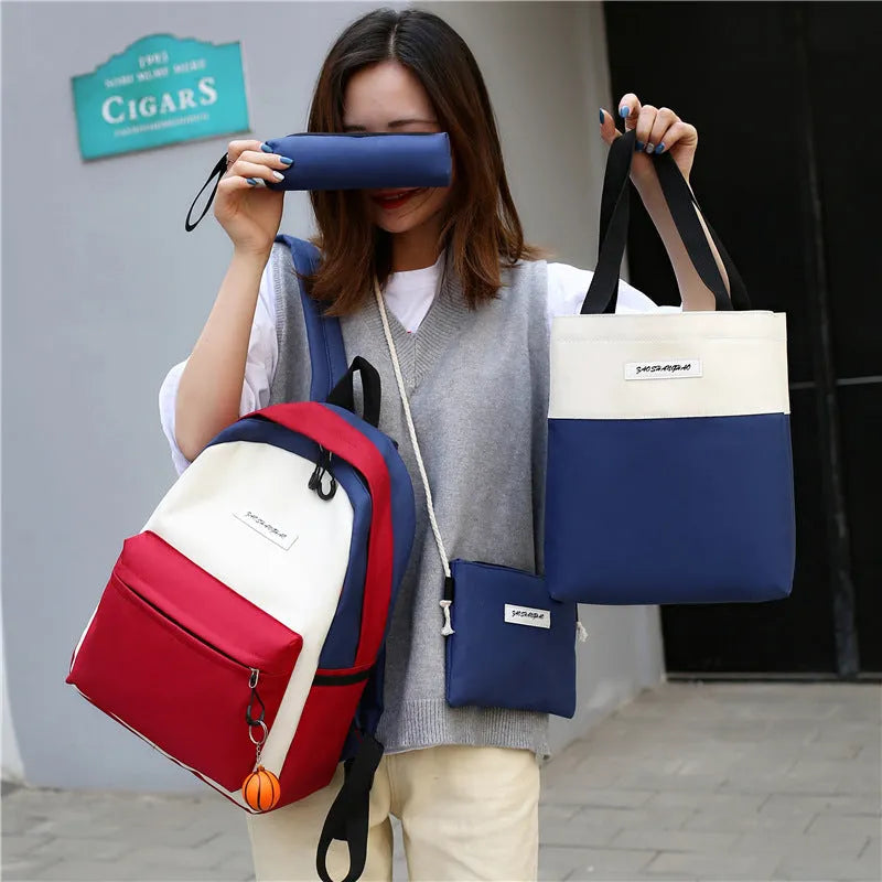 Four medium canvas backpacks in black, green, red, and white with zipper closure and air cushion straps