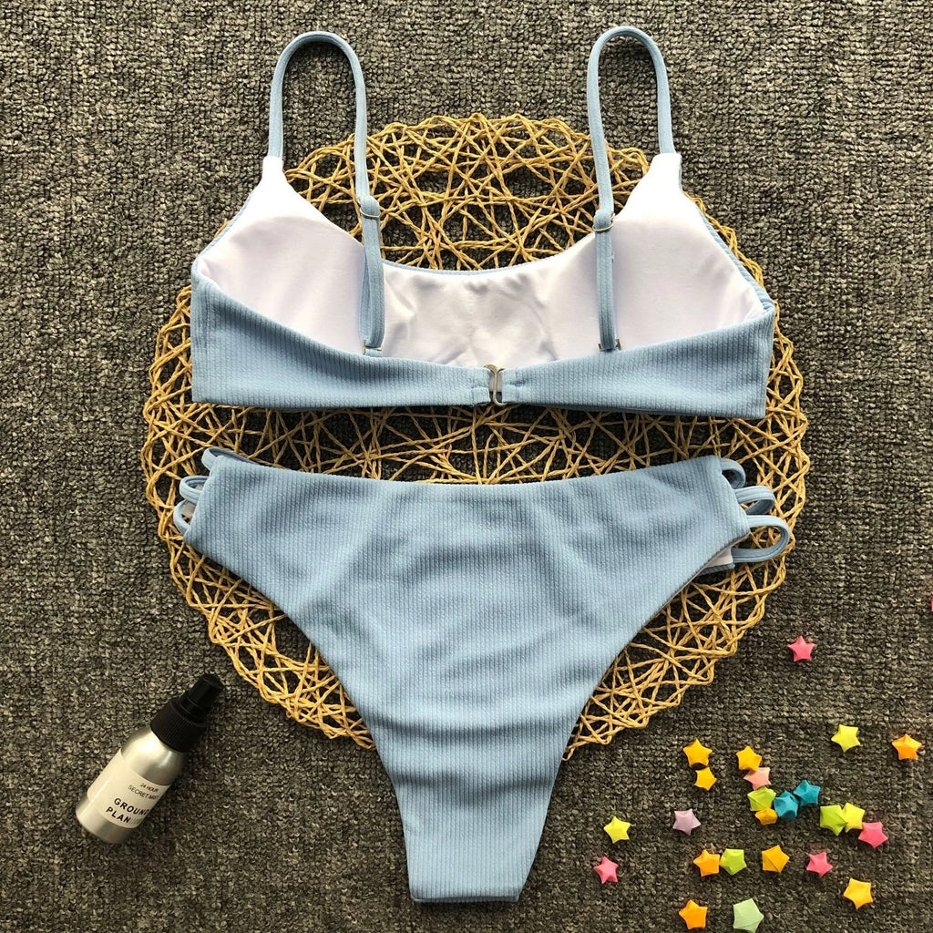 Blue striped bikini set with polyester and nylon fabric, two-piece swimwear on display