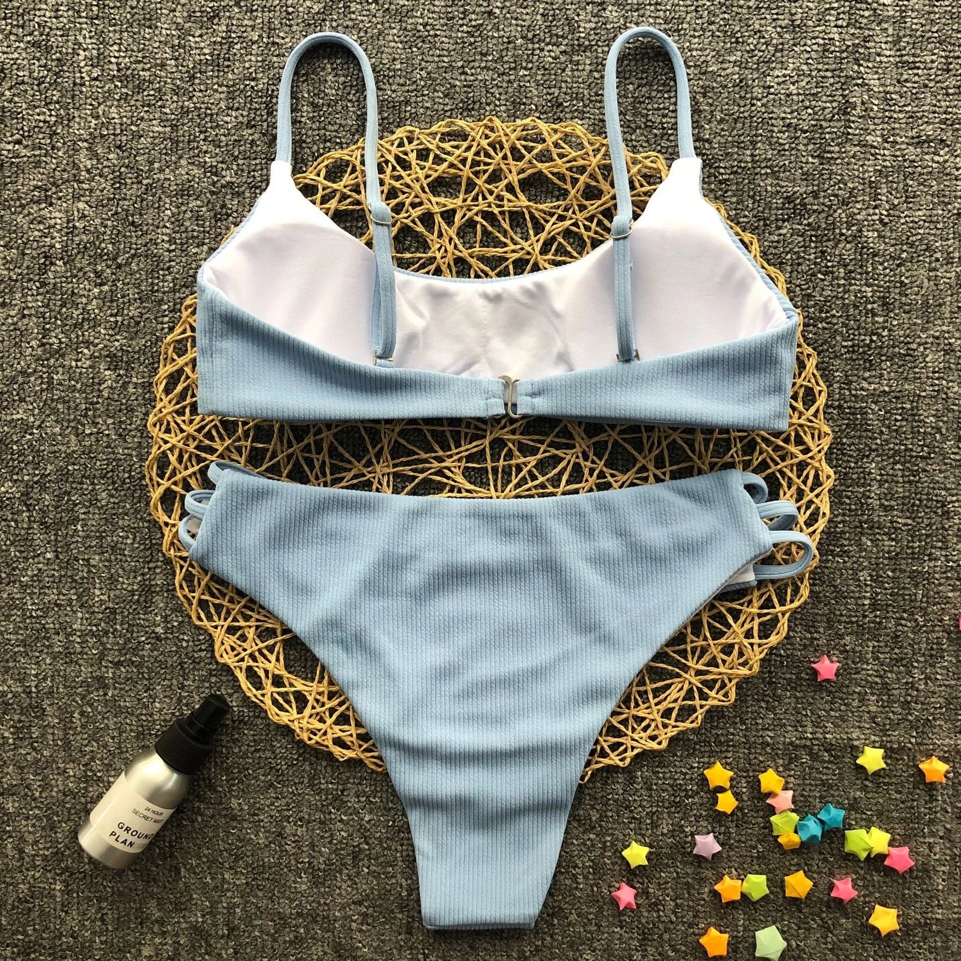 Blue striped bikini set with polyester and nylon fabric, two-piece swimwear on display