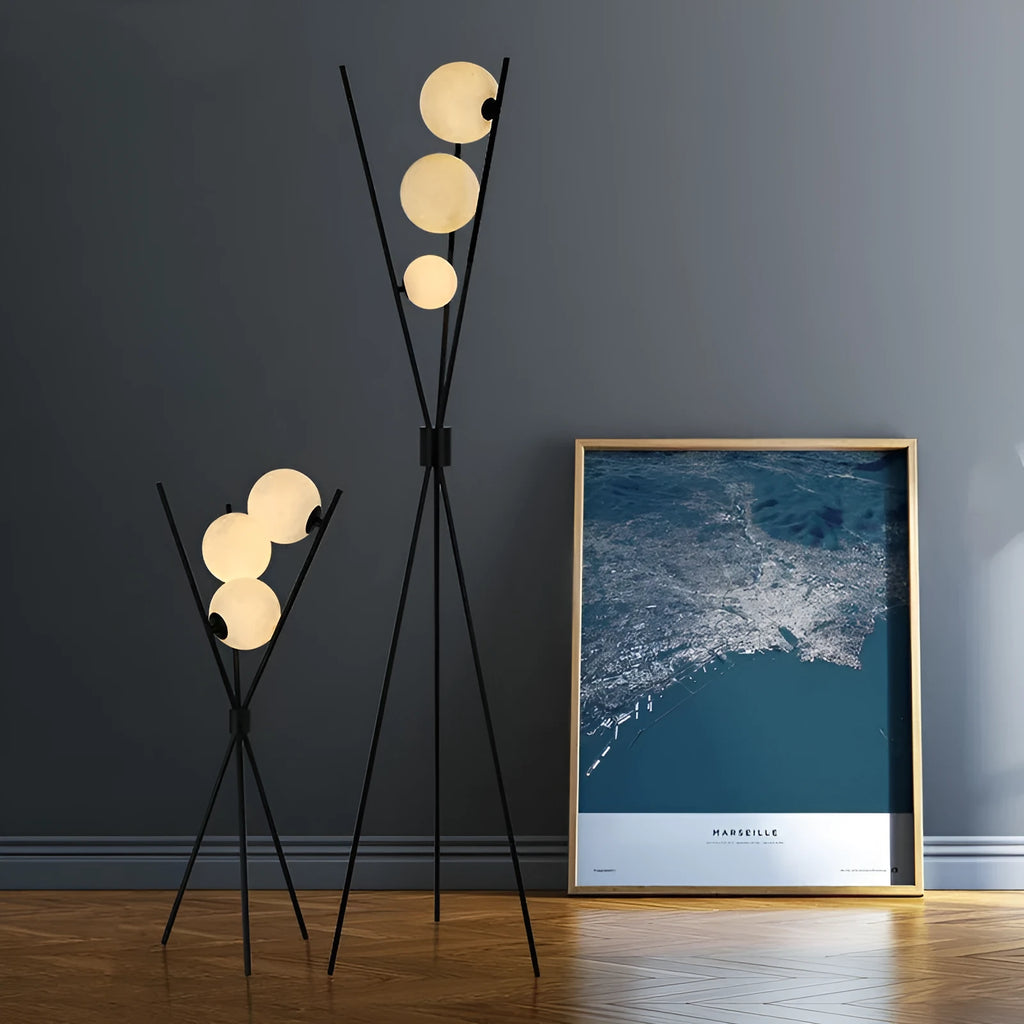 Scandinavian LED table lamp with iron body and acrylic shade on a white table, offering three light colour options