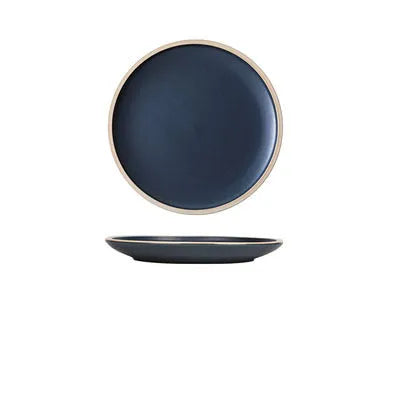 Blue matte ceramic dinner plate 10 inches with sesame point glaze on a table