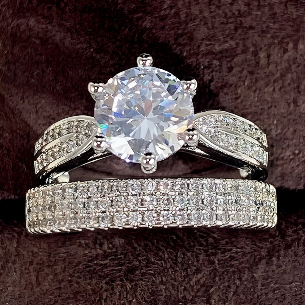 White gold colour wedding ring attached to matching bracelet with geometric shapes and round decorative elements