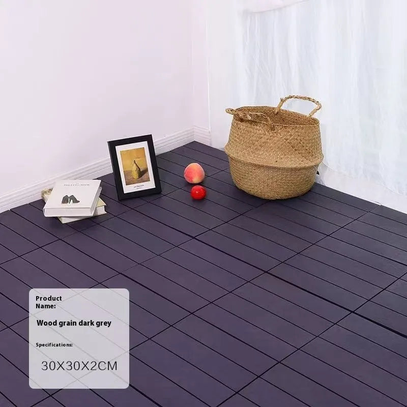 Wood grain plastic floor tiles showing splicing design and non-slip surface texture