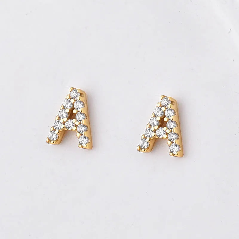 Brass gold plated alphabet letter earrings showing single letter from A-Z range with zircon detailing