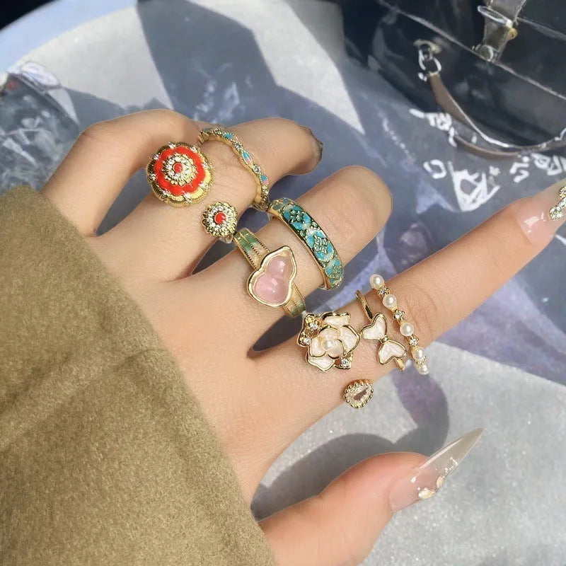 Adjustable copper ring with vintage oil dripping gourd design, zircon inlay, and floral bow shapes in New Chinese style.