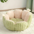 Soft green cactus-shaped pet kennel bed for cats and small dogs on a wooden floor.