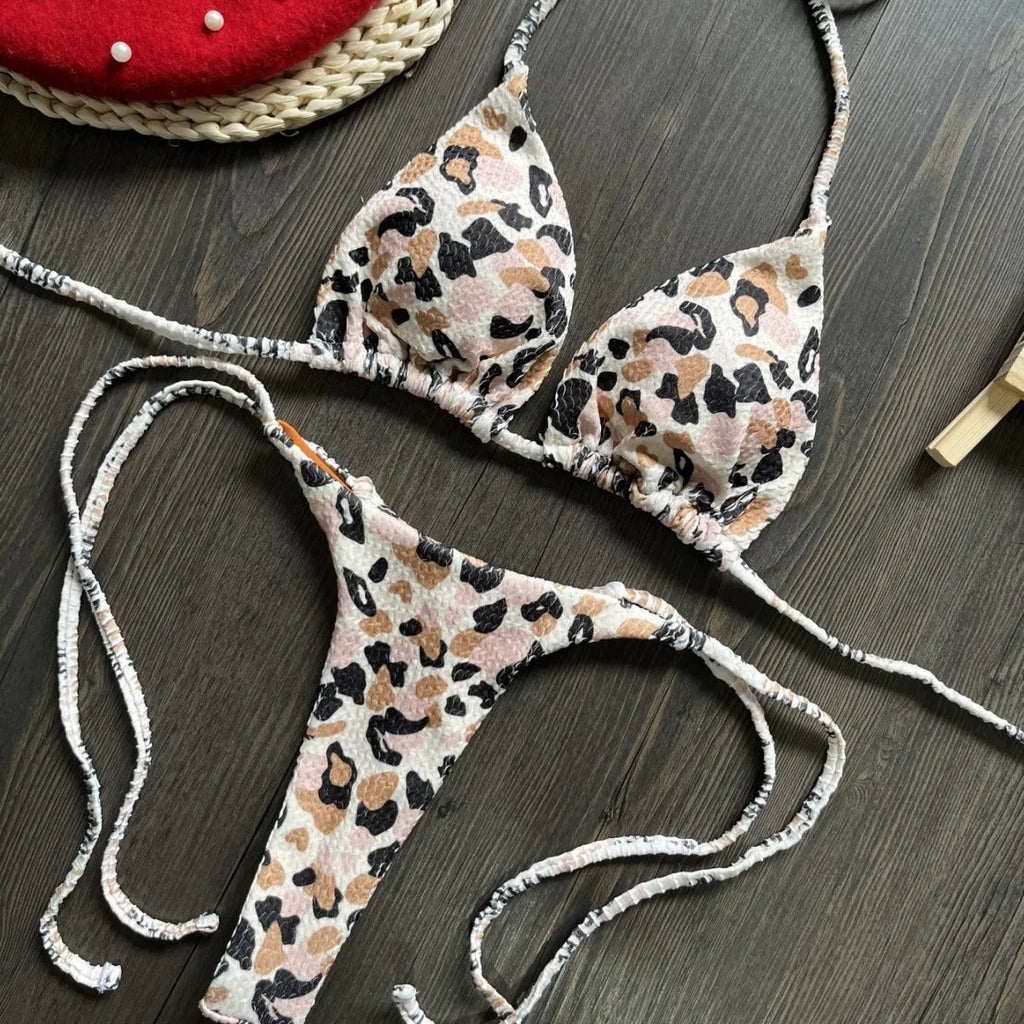 Women's printed bikini swimsuit with briefs style on a neutral background.