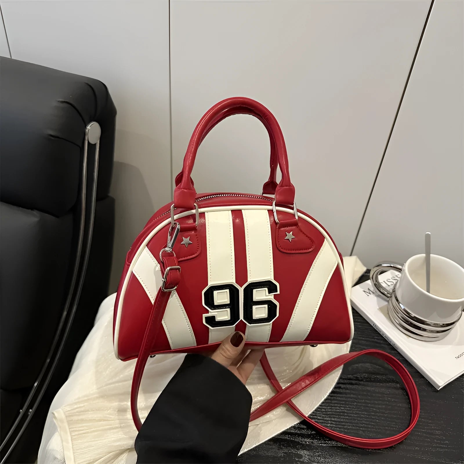 Colourful stripe contrast single shoulder bag in black with stitching and colour blocking details, PU material, dumpling shape