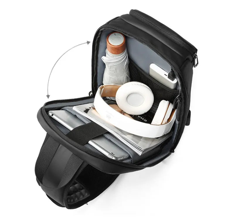 Black medium-sized PVC outdoor shoulder bag with a single strap and internal organiser pockets.
