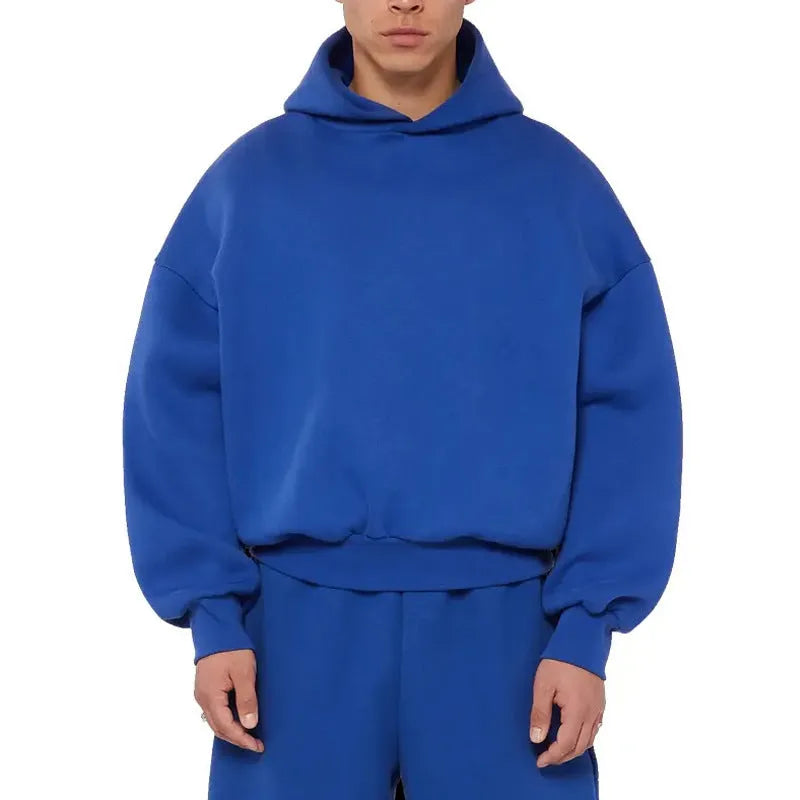 Man wearing a solid colour fleece-lined cotton hoodie sweater with a wool lining.