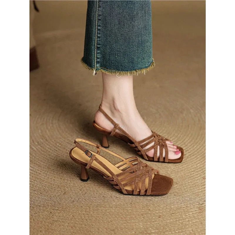 Women's light brown retro sandals with thin cross ankle straps and a square toe on a mid-height heel.