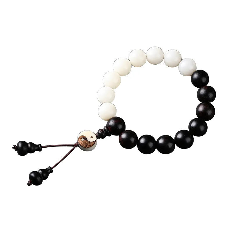 White and black bodhi seed bracelet with eight-diagram pattern, shown as a bracelet and lanyard.