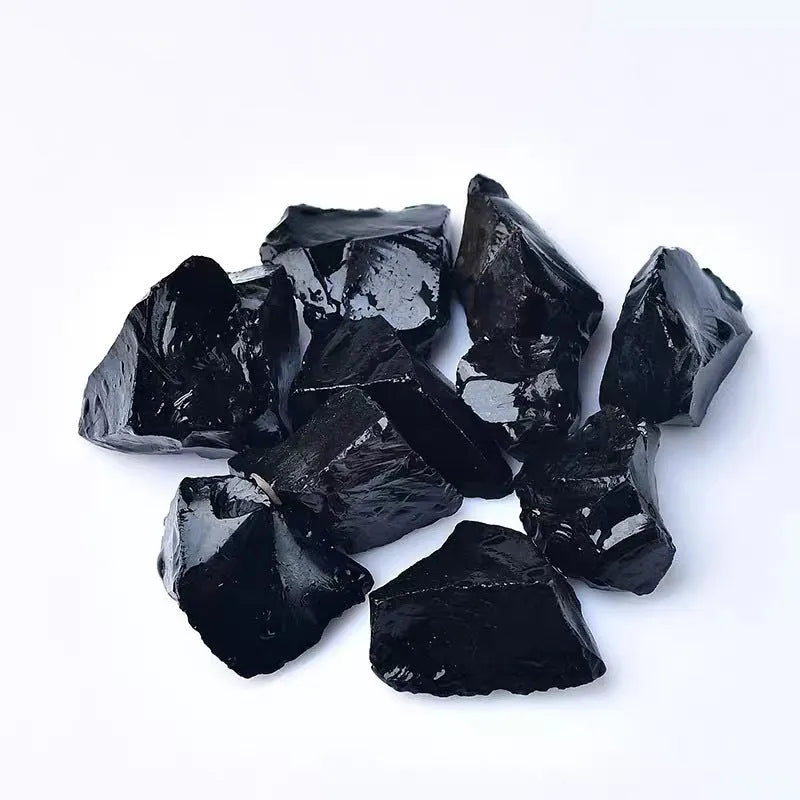 Natural black obsidian rough gravel stones in a pile, size 2-3cm each