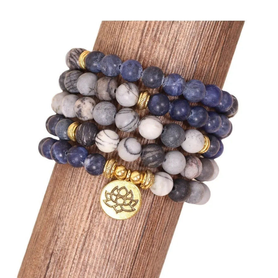 Multi-layer bracelet with blue patterned network stone beads on an alloy base, showing a fresh and sweet natural style.