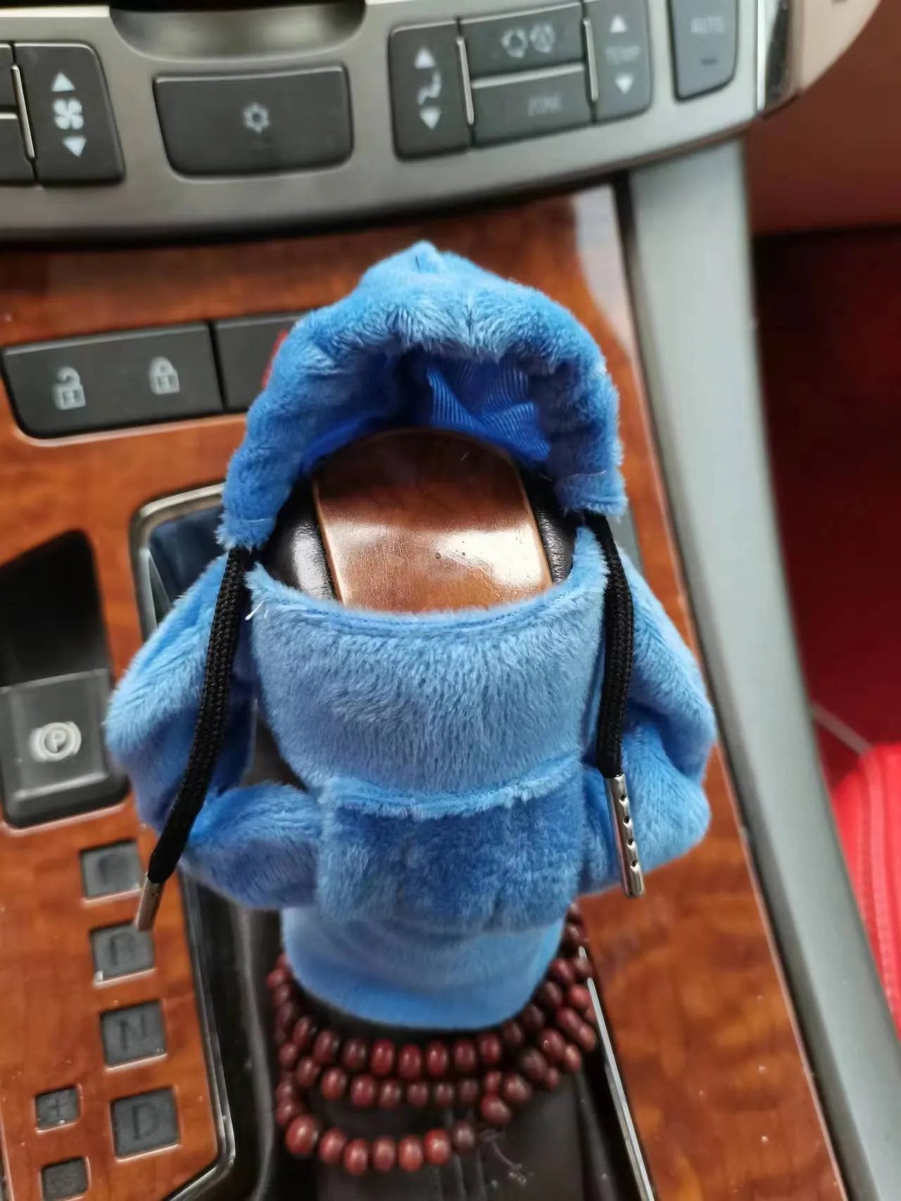 Dutch velvet car gear handle sleeve cover shown in various colours including black, red, blue, and pink.