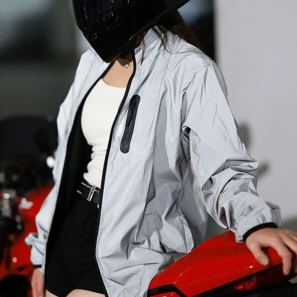 Silver waterproof polyester long sleeved jacket for outdoor wind and rain protection.