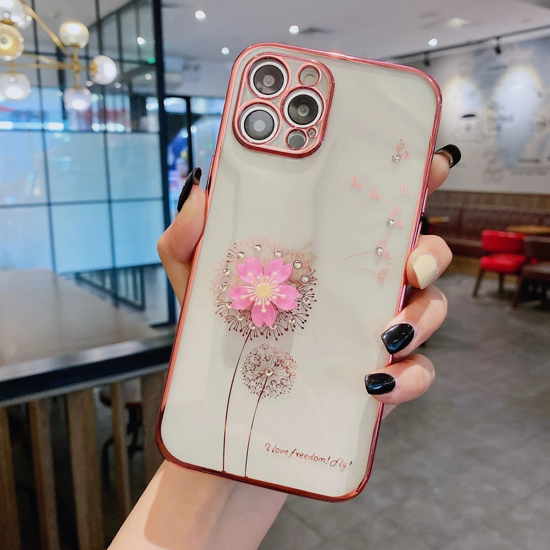 Green 3D floral patterned iPhone case with a silver rotating ring stand on the back.