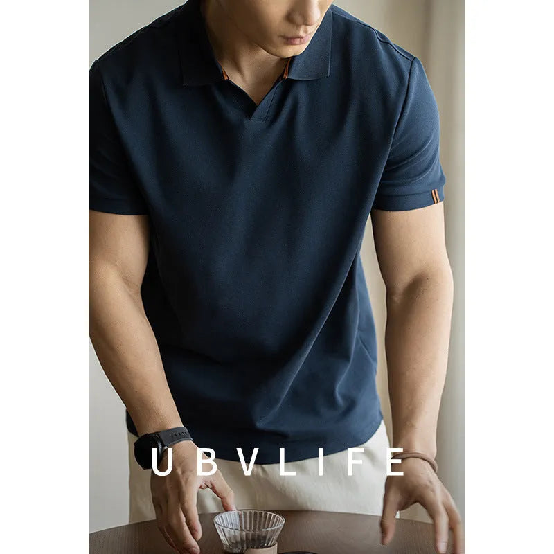 American-style short-sleeved polo shirt in blue cotton blend fabric on hanger