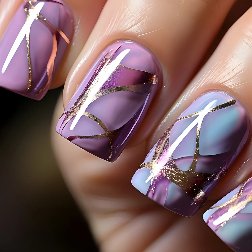 Mid-length purple and white striped nail art stickers on a nail.