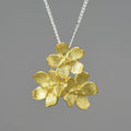 Myosotis Sylvatica sterling silver flower pendant with electroplated finish and hand-designed botanical details