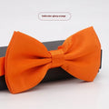 Solid colour flat head bow tie for formal wear in multiple colours including black, red, and blue.