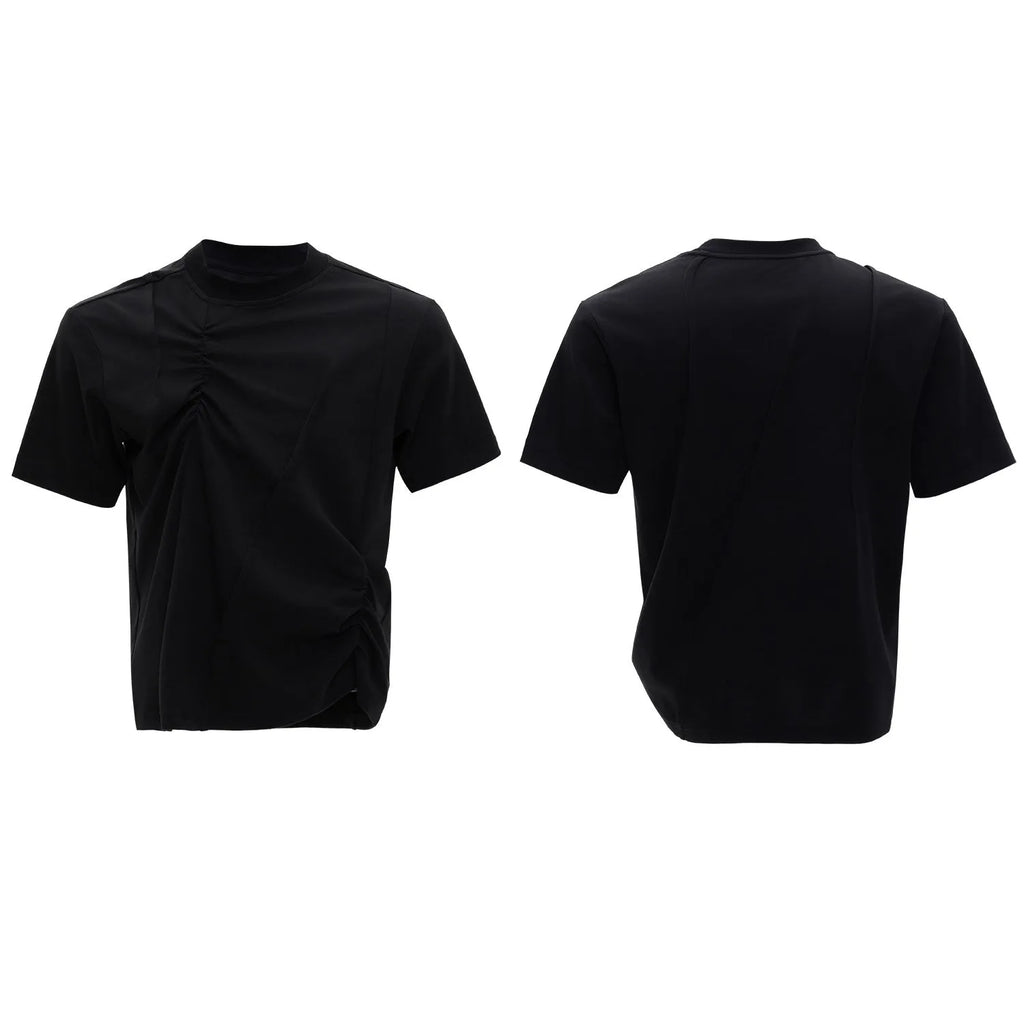Man wearing a black cotton t-shirt with textured 3D pleating and a round neck