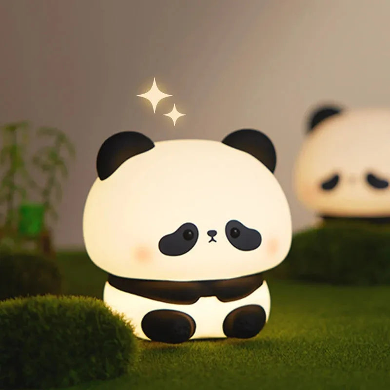 Panda LED night light with soft silicone head and colourful glow on a wooden table