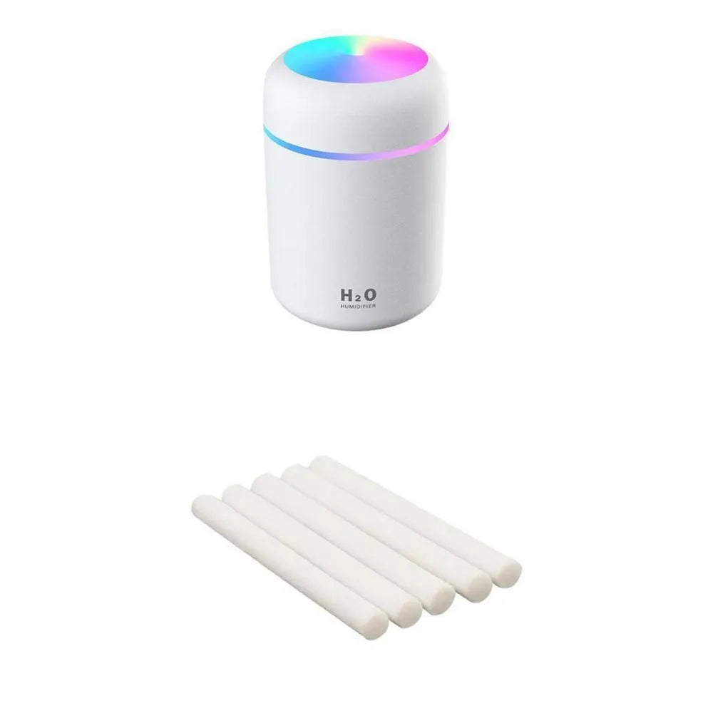 Pink USB desktop humidifier with colourful LED lights and 300ml water tank on wooden desk