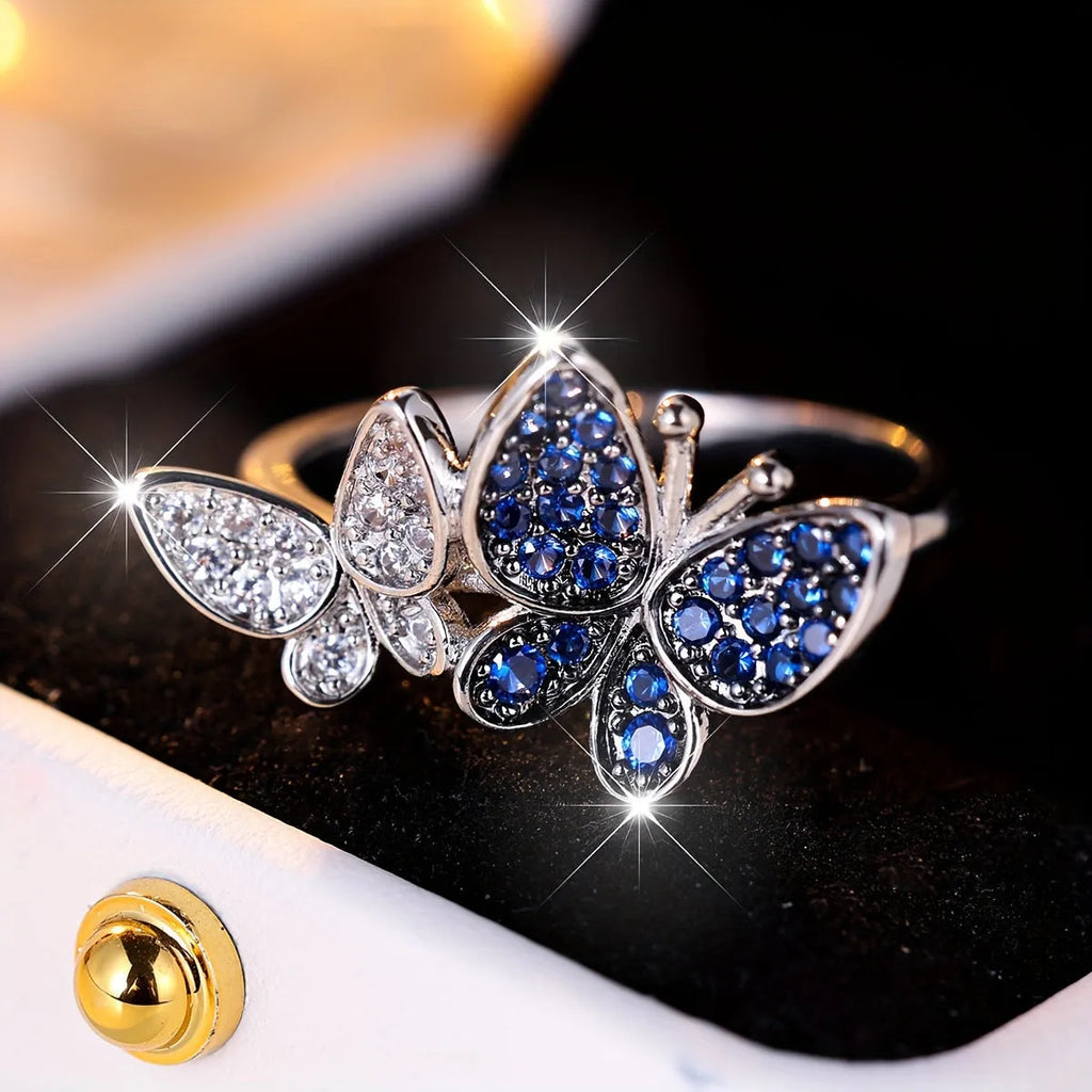 Blue and white copper butterfly ring for women TJZ40135 on plain background