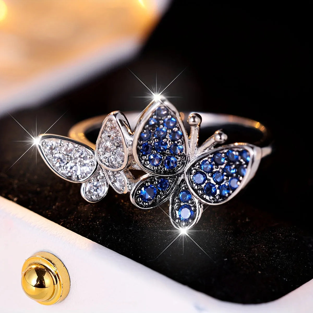 Blue and white copper butterfly ring for women TJZ40135 on plain background